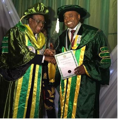 Kenneth Okonkwo receiving his Doctorate certificate