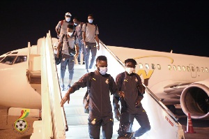 Some of the players getting off the plane