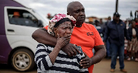 Bekkersdal residents at the scene of the shooting