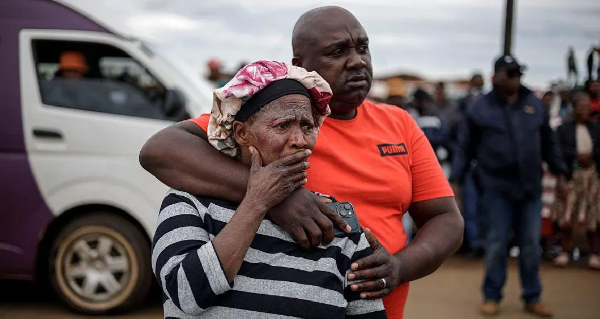 Bekkersdal residents at the scene of the shooting