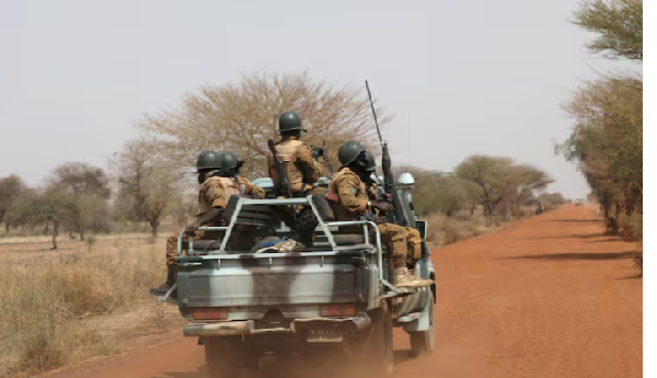 Soldiers from Burkina Faso patrol on the road of Gorgadji in the Sahel area