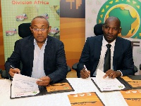 CAF President, Dr Ahmad (left) and FIFPro Africa Division President, Geremi Njitap signing the deal