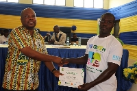 A beneficiary receiving his certificate