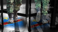 Graphic illustration of soldiers entering and exiting doors