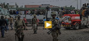 M23 rebels escort government soldiers and police who surrendered to an undisclosed location in Goma
