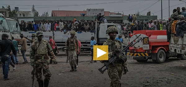 M23 rebels escort government soldiers and police who surrendered to an undisclosed location in Goma