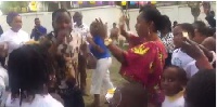 The Second Lady [in white t-shirt behind Funny Face] dances with pupils at the book reading event