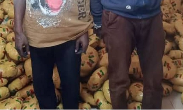 Two of the suspects with the intercepted parcels of substances suspected to be narcotics