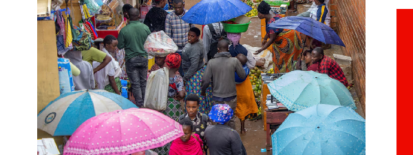 Residents shop at an open-air market on the outskirts of Kigali, Rwanda.