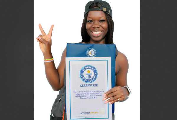 Wash-car-a-thon record holder, Felicity Asantewaa receives official certificate from World Records Office