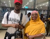 Kudus and his mother at the airport