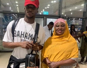 Kudus and his mother at the airport