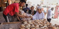 People buy bread at a bakery in Khartoum, Sudan