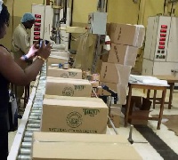 Some workers packaging products for export