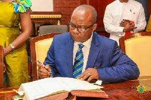 Dr. Ernest Kwamina Yedu Addison Signs Document 500