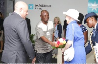 Queen Margethe II of Denmark interacting with others at the Tema Port