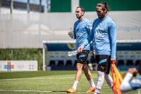 Uruguay defender, Diego Godin(with the bottle) in training