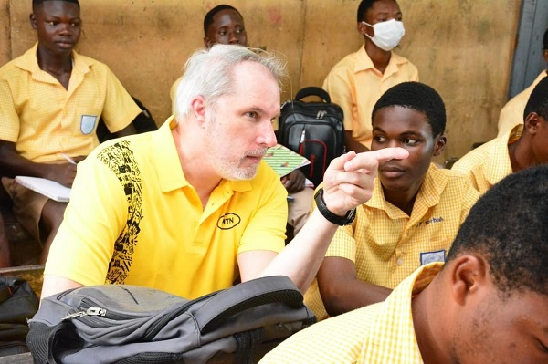 CEO of MTN Ghana, Stephen Blewett interacting with students of Aburi Presbyterian STS