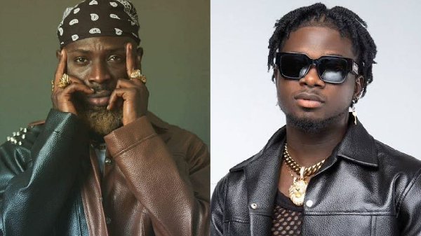 Kwame Yogot (L) threatens colleague Kuami Eugene (R)