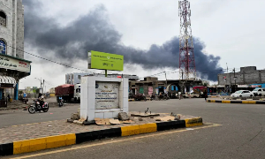 Smoke rises during Houthi missile and drone attacks on the Red Sea port city of al-Makha
