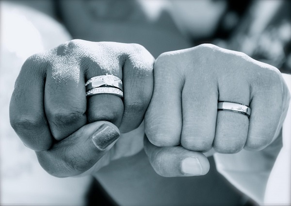 File photo of a couple flaunting their wedding rings
