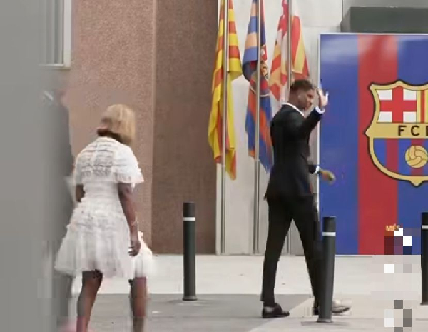 Rashford (R) waving at fans in Barcelona