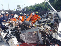 First responders inspect the helicopter crash site in Lumut, Perak state, Malaysia on April 23, 2024