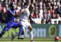 Baba Rahman tackles Ghana's Andre Ayew