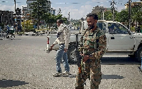 A pro-government soldier standing guard on a street in Ethiopia's Tigray region on Sunday