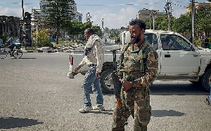 A pro-government soldier standing guard on a street in Ethiopia's Tigray region on Sunday
