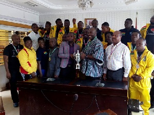 Isaac Asiamah and the Golden Arms team