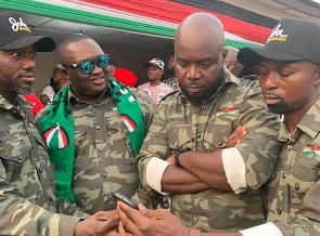 The NDC officials in military camouflage at a party function