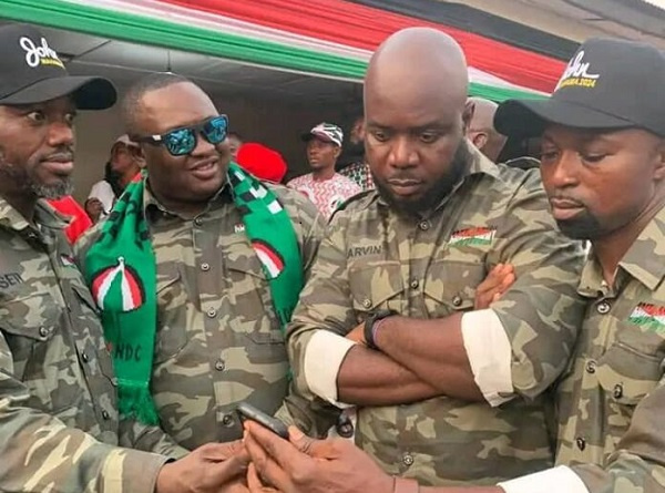 The NDC officials in military camouflage at a party function