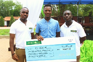 Sylvester Williams (middle) with his cash prize