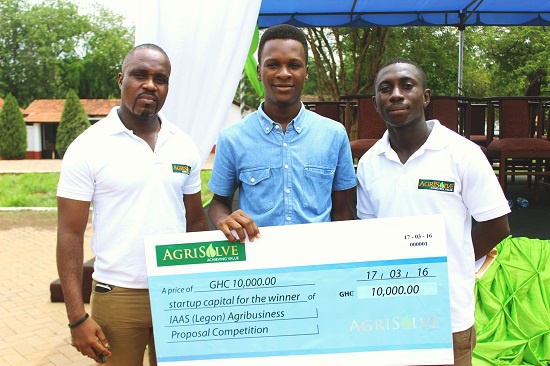 Sylvester Williams (middle) with his cash prize