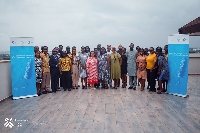 Participants in a group photo after the forum