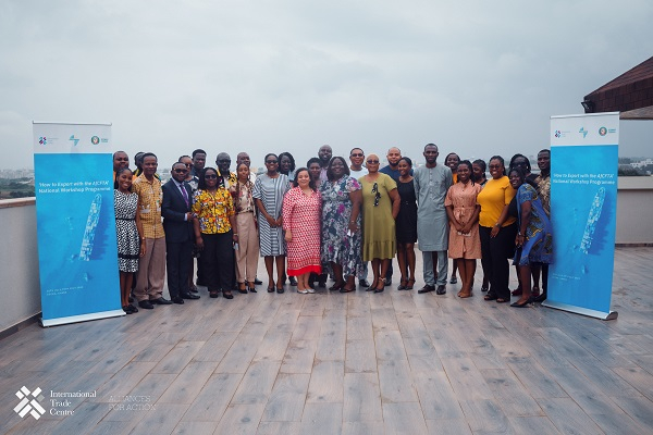 Participants in a group photo after the forum