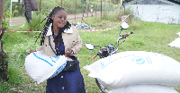 A woman receives food aid at an Ebola treatment centre in Ituri