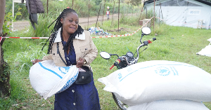 A woman receives food aid at an Ebola treatment centre in Ituri