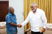 JJ Rawlings in a handshake with Kojo Yankah, founder of AUCC