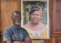 Edward Kufuor poses with his mother's photo