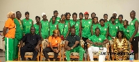 Kurt Okraku seated in the middle with players and officials from Niger