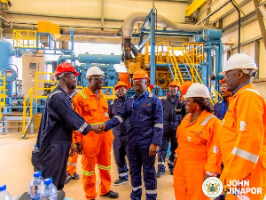 John Jinapor (Middle) pictured with staff of Atubo Gas Processing Plant