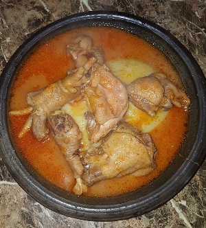 Carrot chicken light soup served with fufu