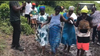 Villagers helped pregnant woman through a muddy road to reach a car for hospital transport