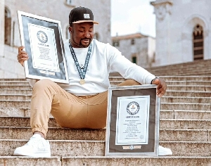 Okine Poses With His World Records On Instagram