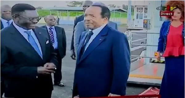 TV picture show as officials and supporters dey greet President Paul Biya for di airport