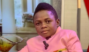 Actor Yaw Dabo in a pink shirt