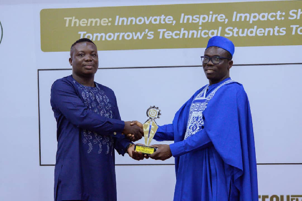 Dr Essien (R) receiving his recognition