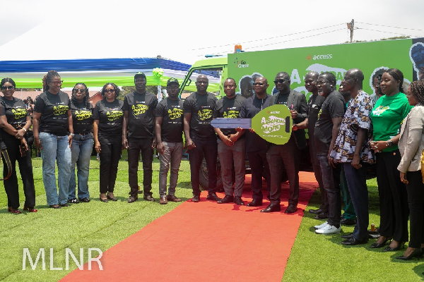 Mr. Joseph Osiakwah in a group photo with staff and volunteers of Access Bank